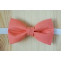 Pink pre-tied bow tie with white strap